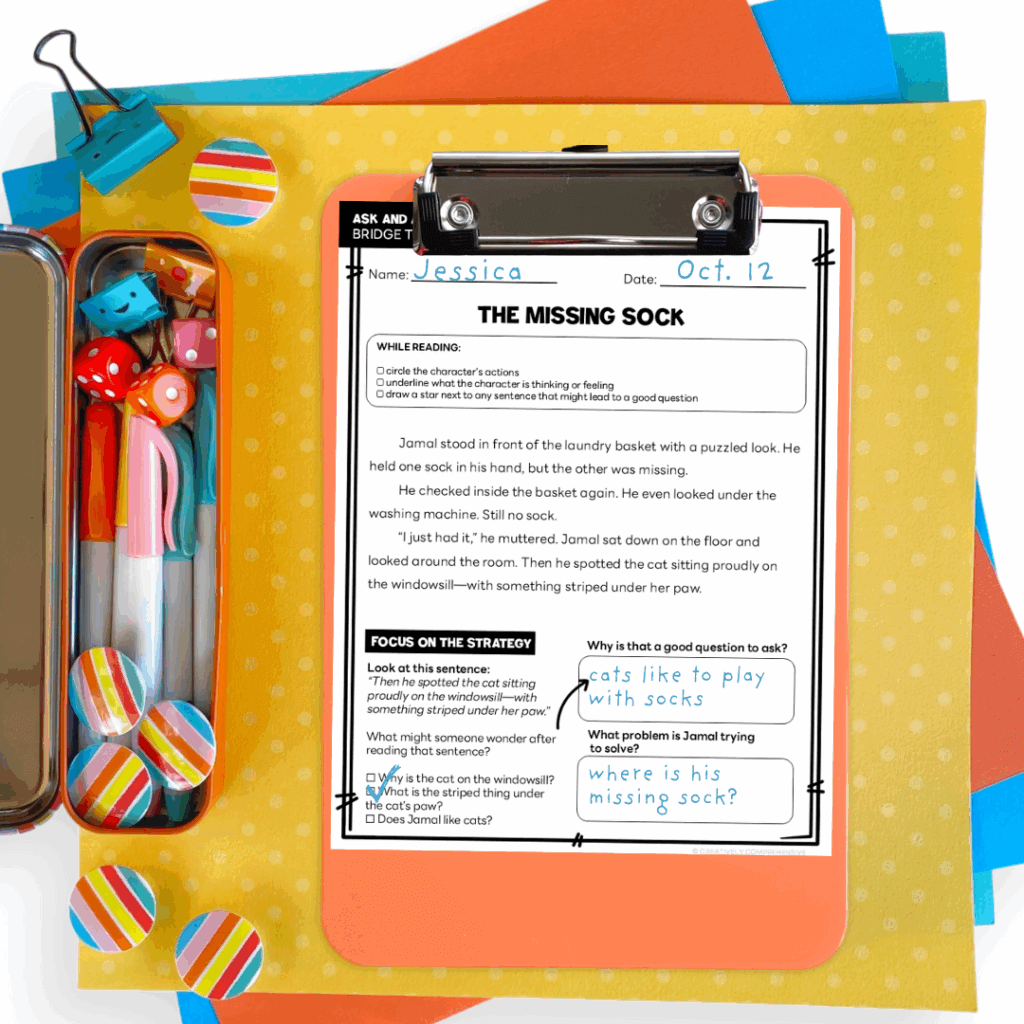 Flat lay of a 3rd grade reading worksheet titled “The Missing Sock,” with a student’s handwritten responses focused on asking and answering questions. The page is clipped to a clipboard and surrounded by colorful school supplies on a light wood and paper background.